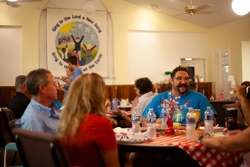 Church family sharing a potluck meal at The Way